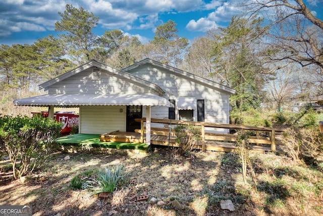 view of front of home featuring a wooden deck