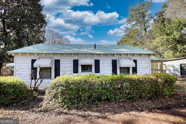 exterior space featuring metal roof