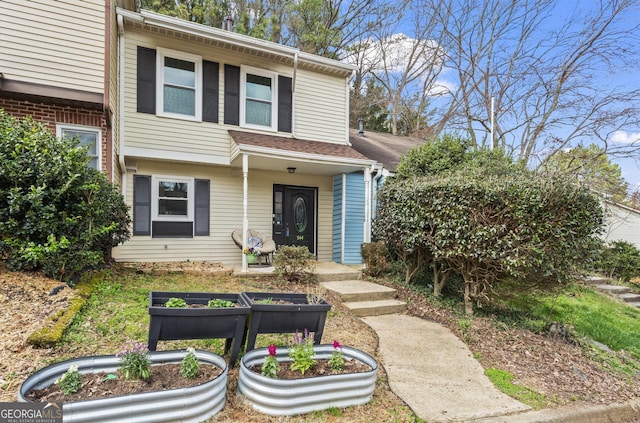 view of front of home featuring a vegetable garden