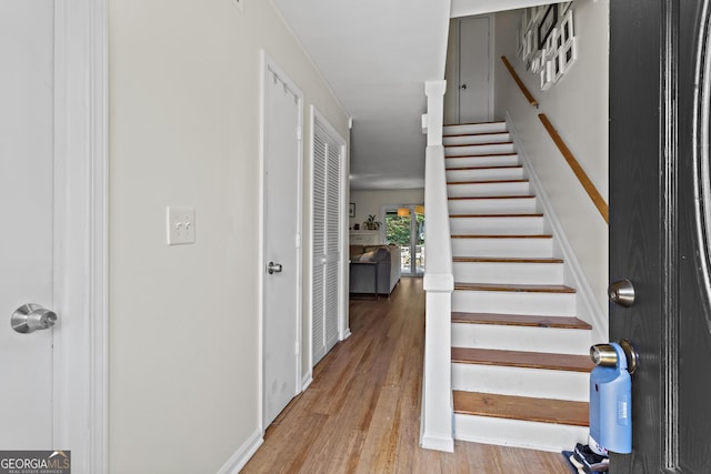 stairs with wood finished floors