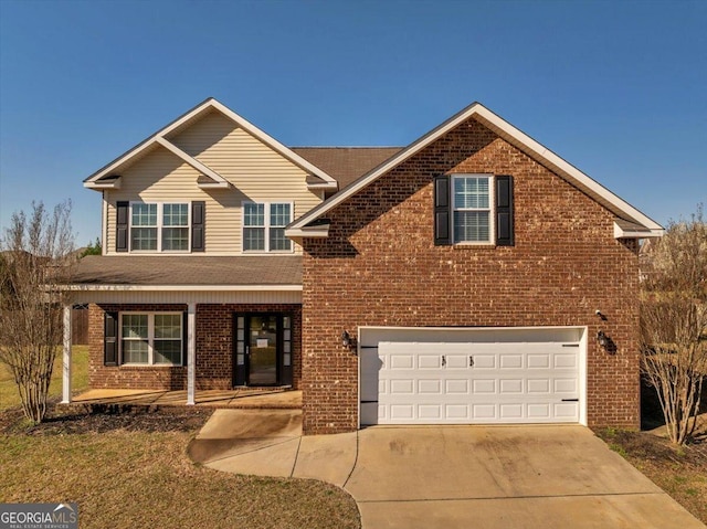 traditional-style house with a garage, brick siding, covered porch, and driveway