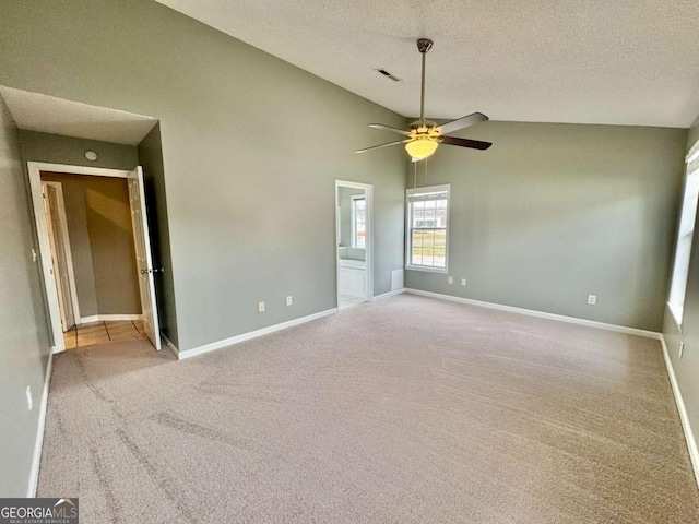 carpeted empty room with baseboards, visible vents, a textured ceiling, and ceiling fan