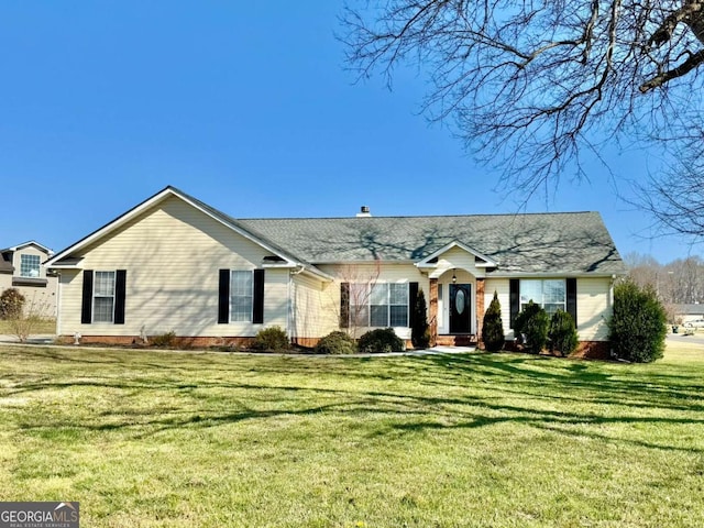 view of front of property with a front lawn