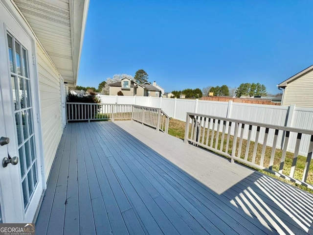 deck with a fenced backyard