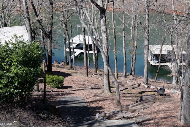 exterior space with a water view and boat lift