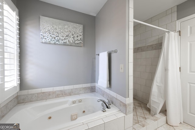 bathroom with a stall shower and a whirlpool tub