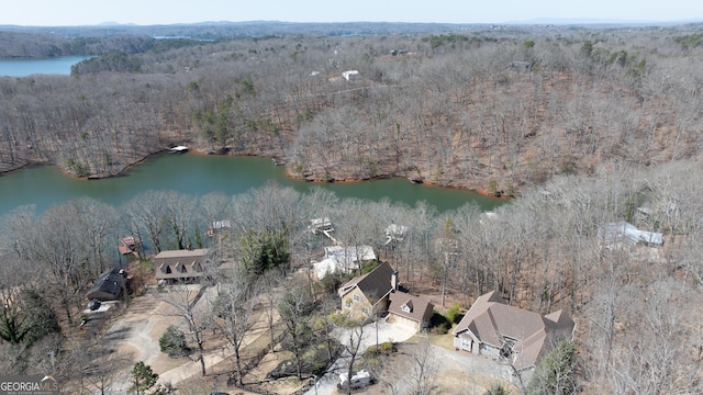 aerial view with a forest view and a water view