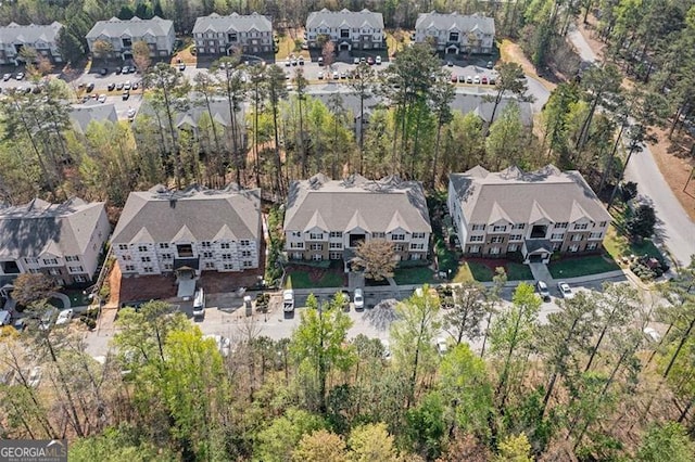 birds eye view of property with a residential view