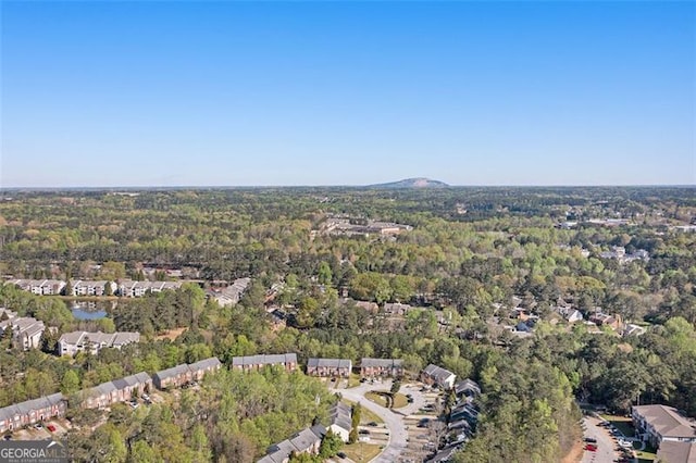 drone / aerial view featuring a forest view
