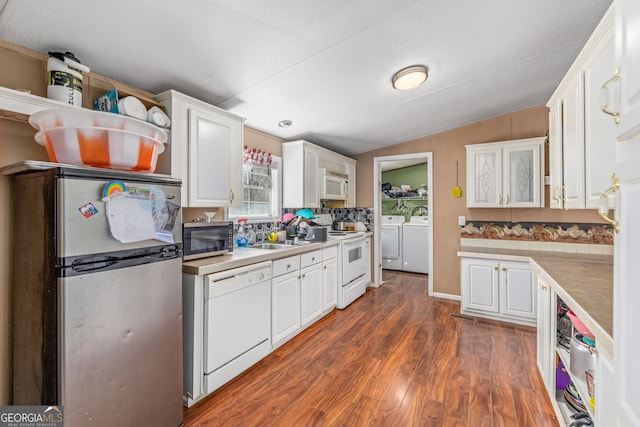 kitchen with dark wood-style floors, washer and dryer, white cabinets, and stainless steel appliances