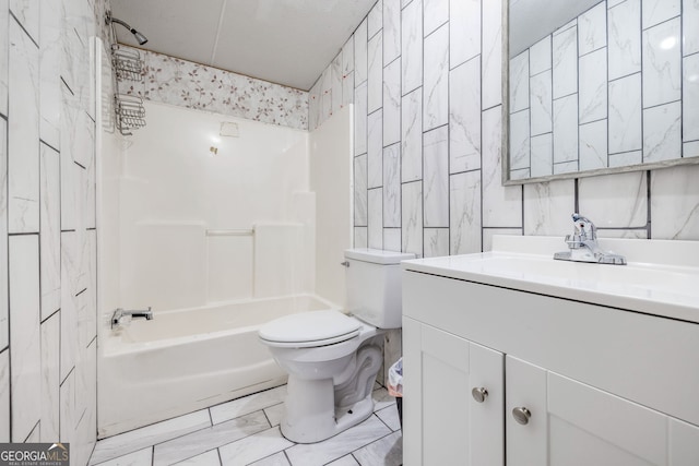 full bath featuring vanity, shower / tub combination, tile walls, toilet, and marble finish floor