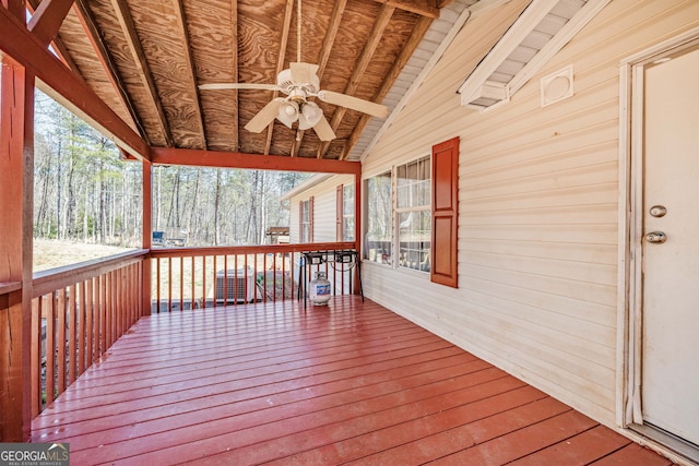 wooden terrace featuring a ceiling fan