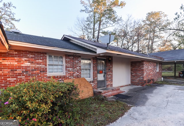 view of front of home featuring brick siding