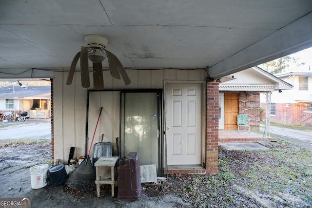 view of exterior entry with brick siding