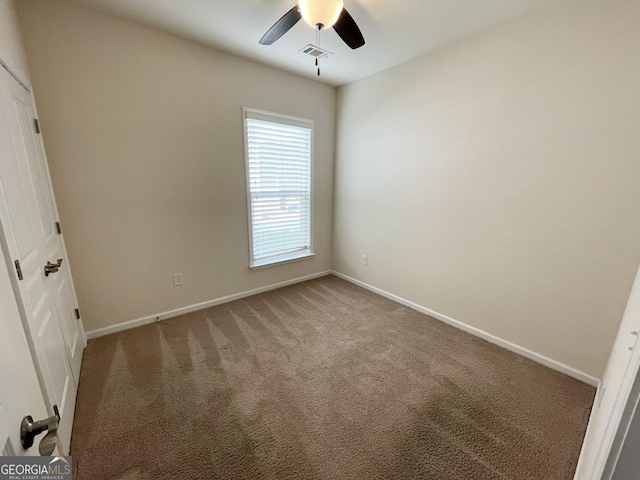 unfurnished bedroom with visible vents, carpet floors, baseboards, and ceiling fan