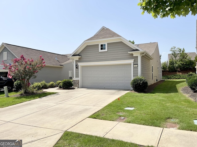 view of front of house with a garage, driveway, a front yard, and a shingled roof