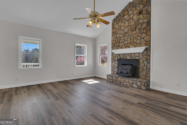 unfurnished living room featuring baseboards, plenty of natural light, wood finished floors, and a ceiling fan