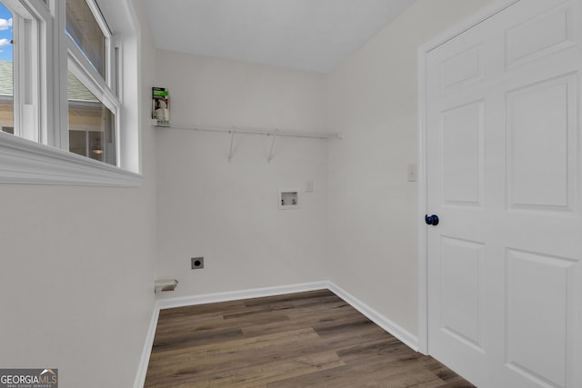 clothes washing area with electric dryer hookup, wood finished floors, baseboards, hookup for a washing machine, and laundry area