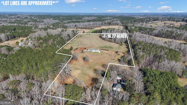 aerial view with a wooded view