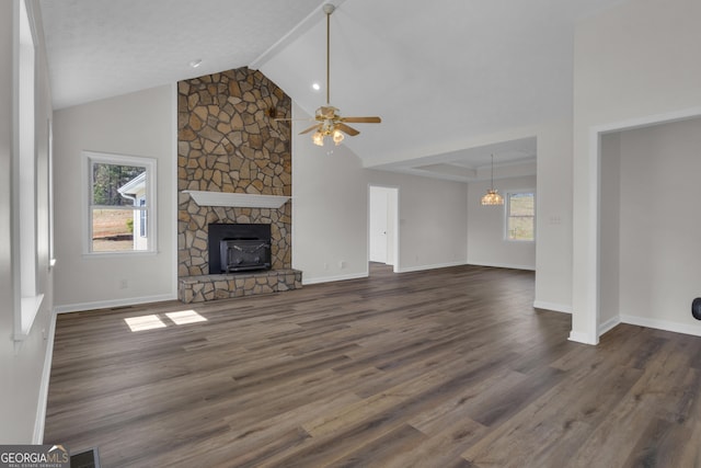 unfurnished living room with dark wood finished floors, visible vents, baseboards, and ceiling fan