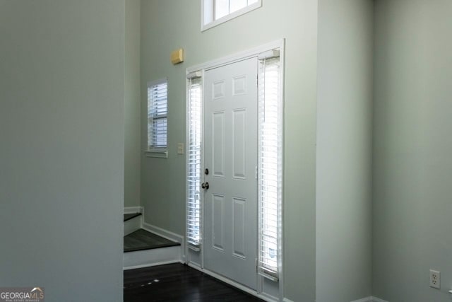 entrance foyer with dark wood-style flooring