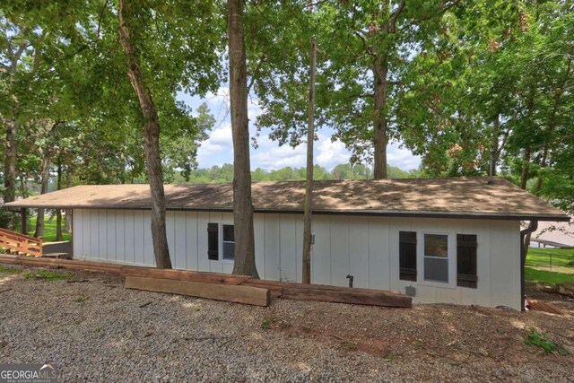 view of property exterior featuring roof with shingles