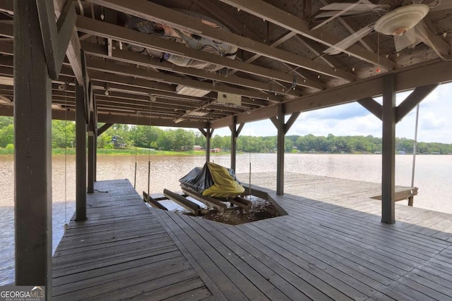 dock area featuring boat lift and a water view