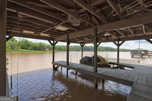 view of dock featuring boat lift and a water view