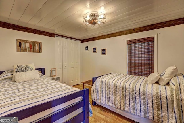 bedroom with a closet and light wood-type flooring
