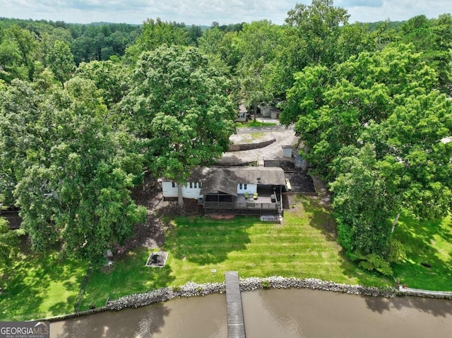 aerial view with a water view and a wooded view