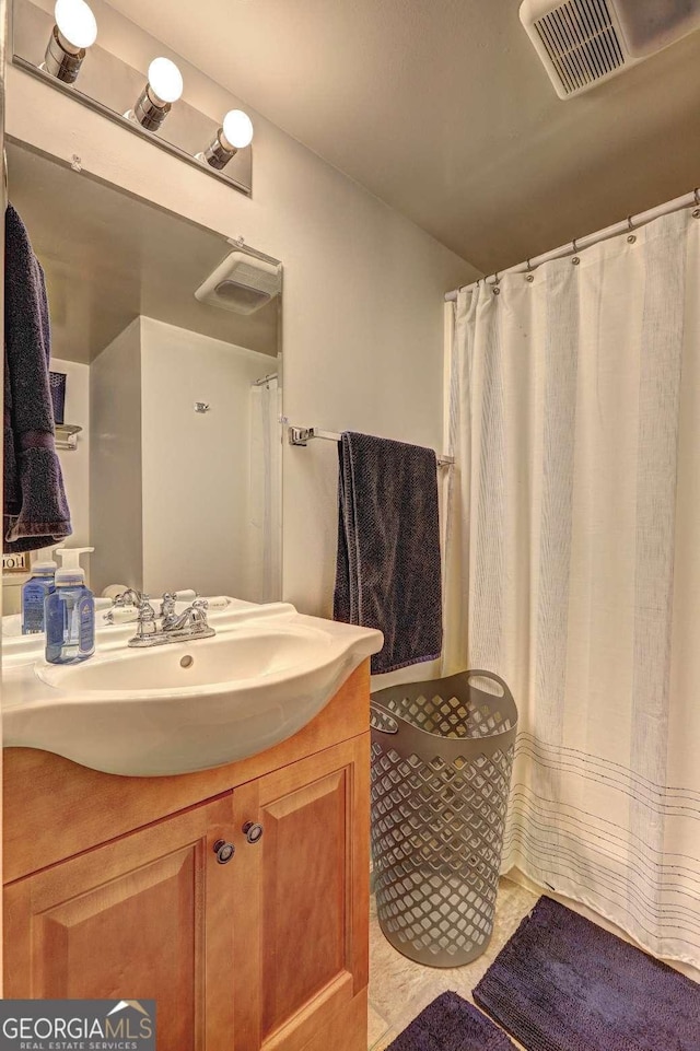 full bath featuring visible vents, tile patterned flooring, and vanity