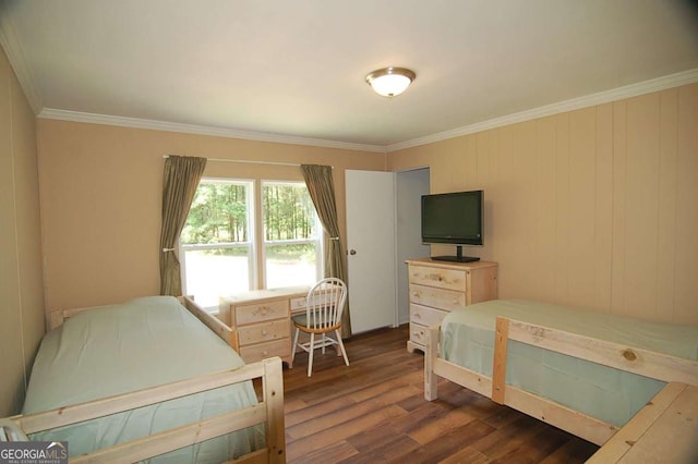 bedroom with dark wood finished floors and ornamental molding