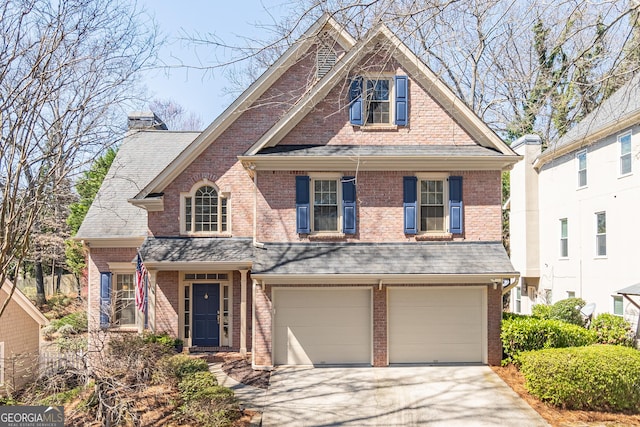 view of front of home with brick siding, concrete driveway, a garage, and roof with shingles