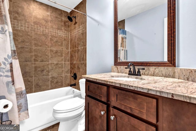 full bath with vanity, shower / tub combo, and toilet