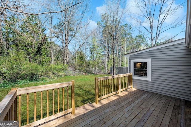 wooden deck with a yard