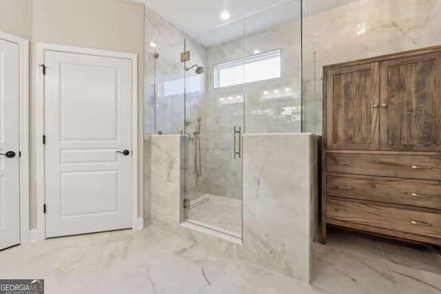 bathroom featuring a marble finish shower and marble finish floor