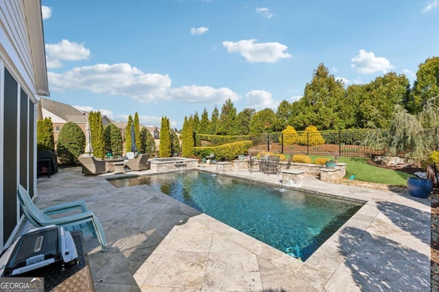 view of pool with a patio area, a pool with connected hot tub, and fence