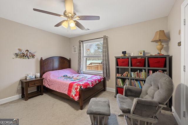 carpeted bedroom featuring visible vents, baseboards, and a ceiling fan