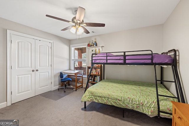 bedroom featuring a closet, carpet flooring, baseboards, and ceiling fan