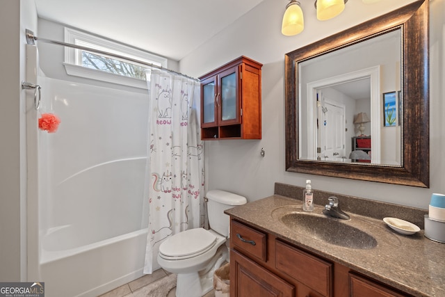 bathroom with shower / tub combo, toilet, vanity, and tile patterned flooring