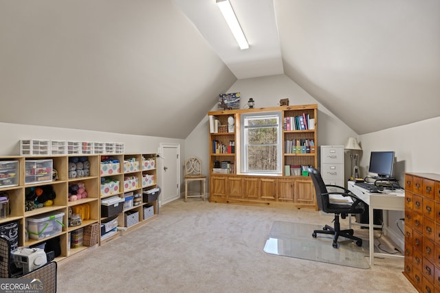 home office featuring lofted ceiling and carpet floors