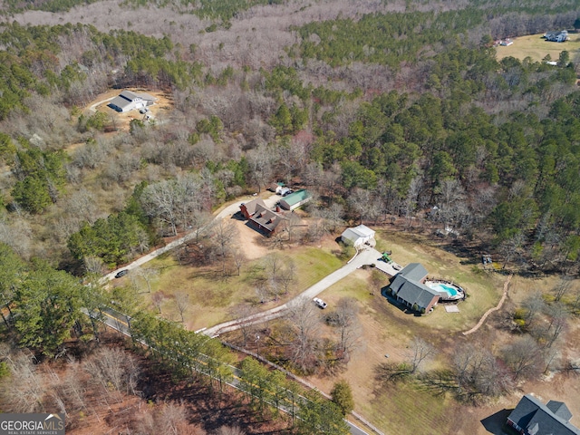 bird's eye view featuring a forest view