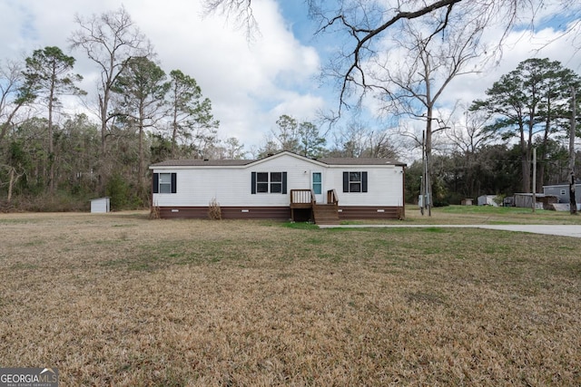 manufactured / mobile home with crawl space and a front lawn