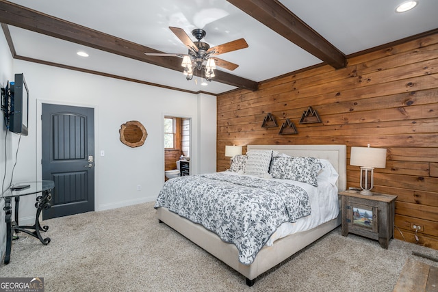 bedroom featuring baseboards, beamed ceiling, wood walls, carpet floors, and recessed lighting