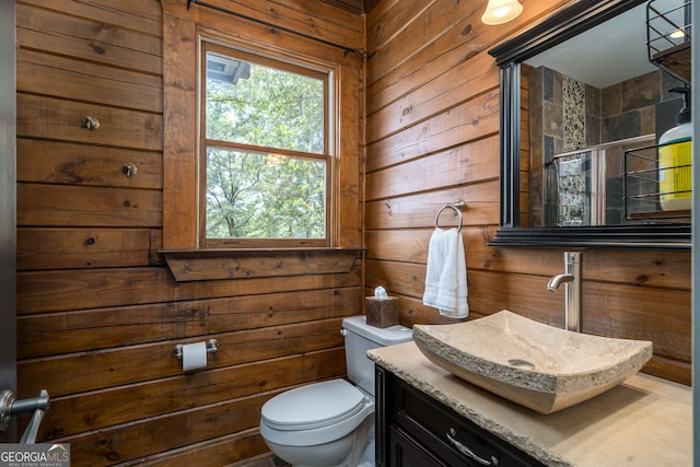 bathroom featuring an enclosed shower, toilet, and wood walls