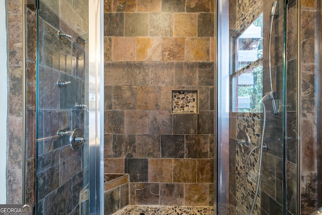 bathroom featuring a shower stall