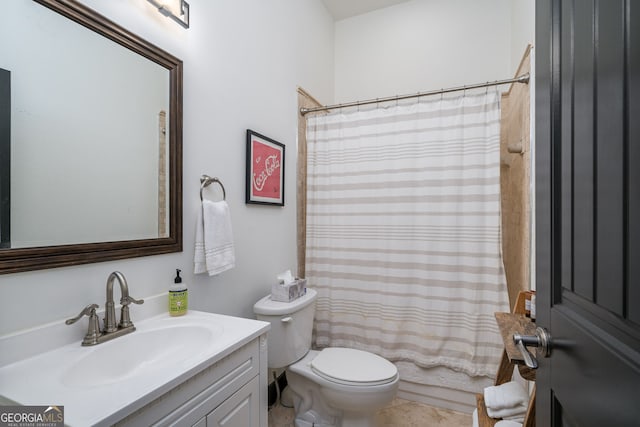 bathroom with toilet and vanity