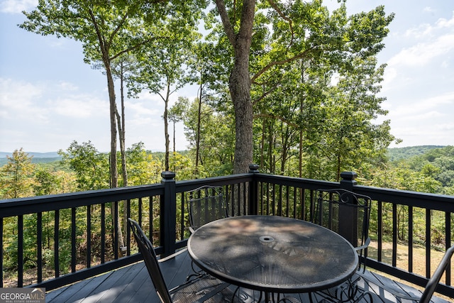 deck with outdoor dining space