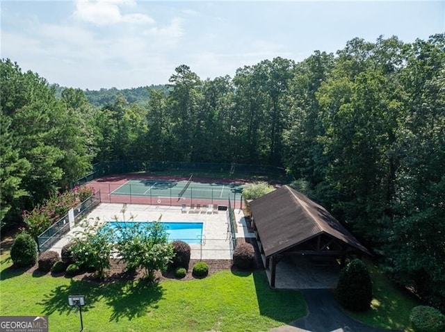 1363 Foxhound Trl NE, Ranger, GA 30734 - view from above of property featuring a forest and a pool