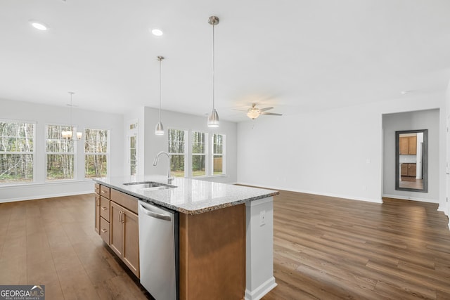 kitchen featuring ceiling fan with notable chandelier, a sink, open floor plan, dishwasher, and dark wood-style flooring